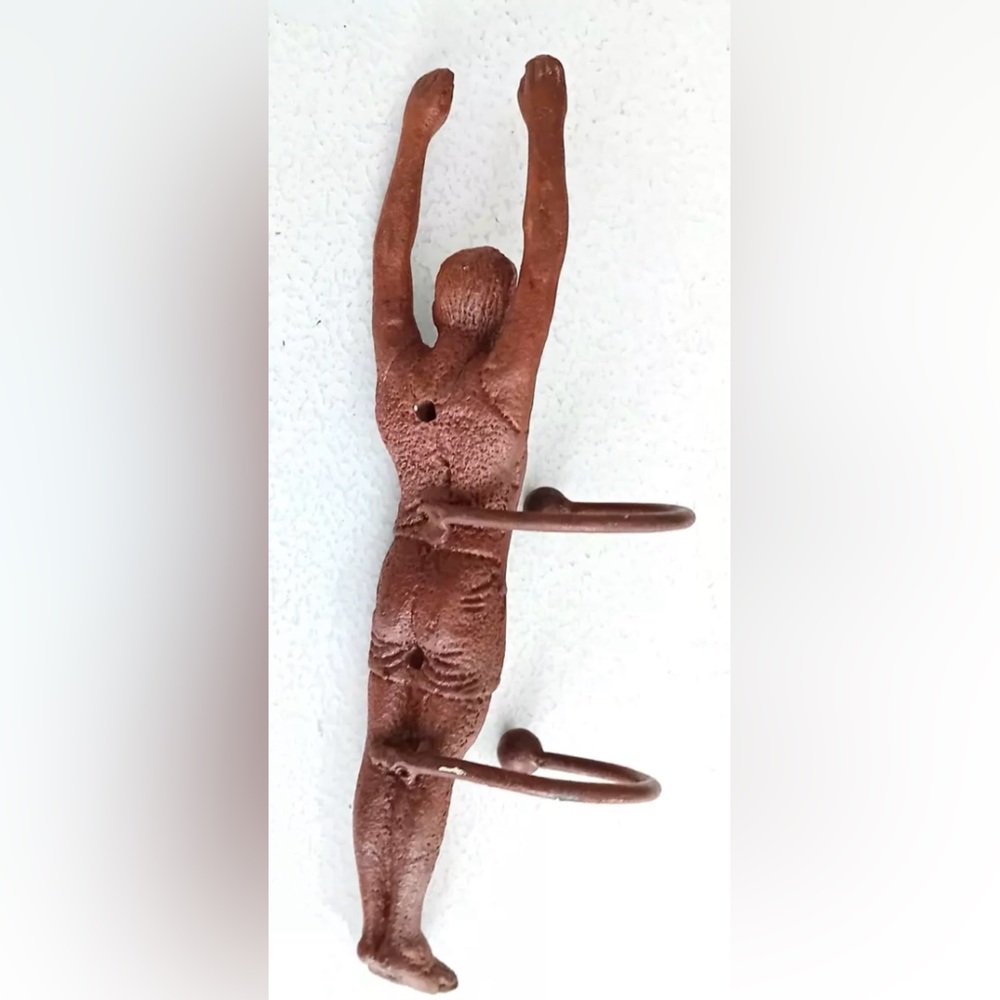 VERY RARE-BROWN CAST IRON WALL HOOK IN THE SHAPE OF A
CHARACTER